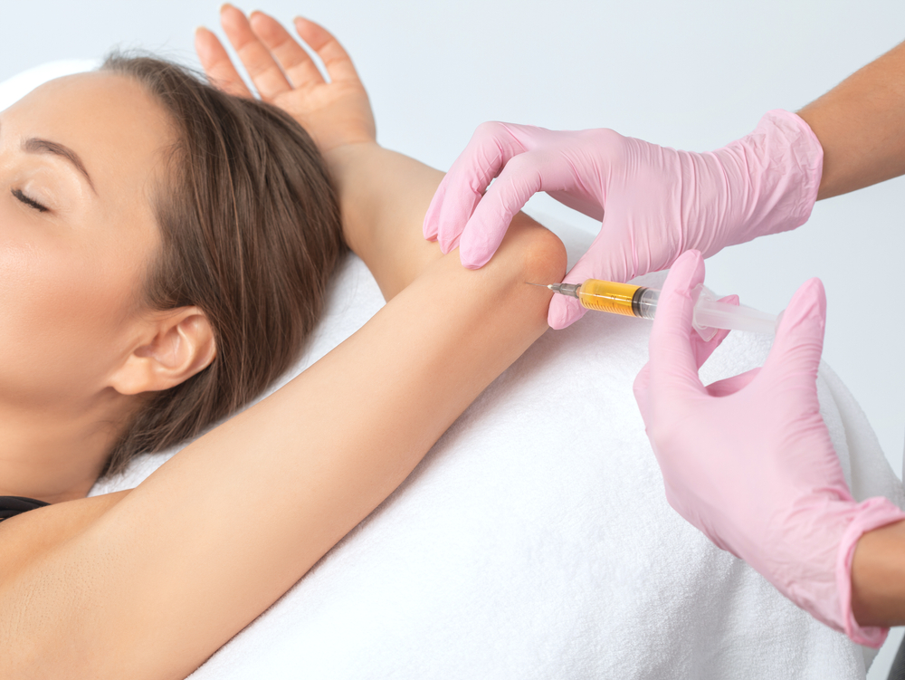 Woman getting stem cells in her elbow